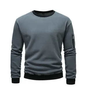 Professional close-up of grey men's fleece crewneck sweatshirt with sleeve zipper detail