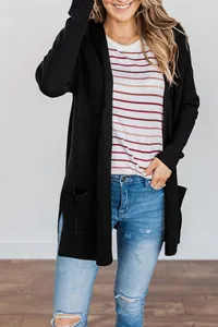 Detailed view of a woman wearing a black open-front hooded cardigan with ribbed cuffs