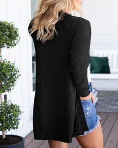 Rear view of black loose chunky knit cardigan with a textured finish for women