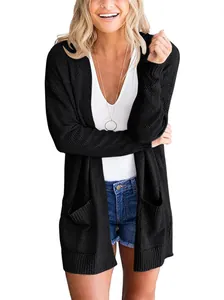 Model wearing a black long sleeve waffle knit cardigan with pockets and open front