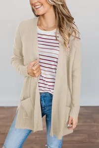 Detailed view of women's comfortable beige long sleeve open front knitted cardigan with pockets