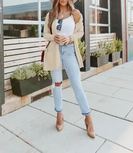 Cozy loose long sleeve knitted cardigan with front pockets in beige for casual wear