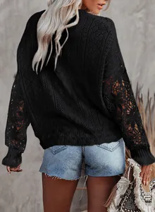 Detailed back view of black knit sweater with intricate hollow lace long sleeves for women.