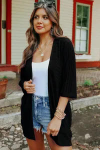 Women's lightweight black knit cardigan with half sleeves and a minimalist solid color design