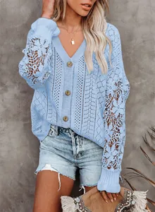 Close-up detail of light blue knit cardigan with elegant hollow-out lace long sleeves.