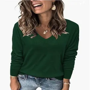 Close-up detail of women's dark green V-neck knit sweater with long sleeves and ribbed texture