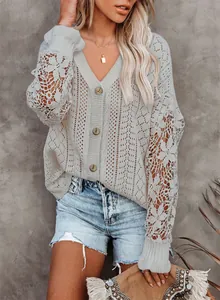 Close-up of elegant V-neck knit cardigan featuring intricate lace floral sleeve details.