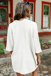 Detailed back view of a stylish white ribbed knit cardigan featuring five-point sleeves for women.