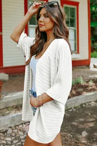 Elegant white knit cardigan featuring half sleeves and a lightweight fabric for spring