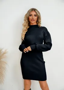 Detailed view of black ribbed knit dress with long puff sleeves for autumn and winter.