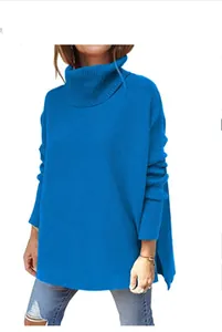 Detailed macro view of a cozy bright blue oversized turtleneck sweater with batwing sleeves