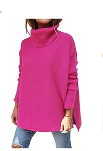 Bright fuchsia oversized turtleneck knit sweater with batwing sleeves and high-low side slits.