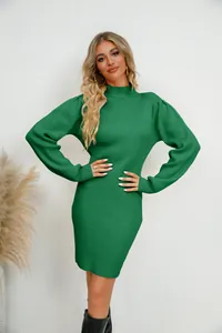 Detailed shot of an elegant green ribbed knit dress featuring stylish lantern sleeves