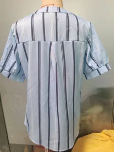 Detailed back view of a light blue vertical striped short-sleeved blouse on a mannequin.