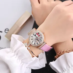 Elegant women's quartz watch with pink leather strap, rhinestone bezel and heart dial set.