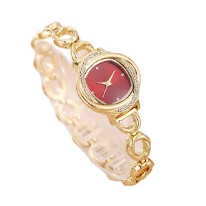 Elegant gold ladies quartz watch with red dial and sparkling crystal bezel decoration.