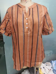 Front view of brown vertical striped short sleeve blouse with V-neck and buttons detail