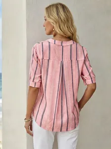 Back view detail of a women's pink striped short-sleeve shirt with a stylish rear pleat