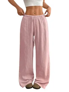 Détail de haute qualité du pantalon large rose en coton et lin avec cordon de serrage