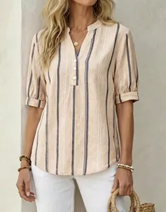 Close-up of summer striped short sleeve blouse with elegant V-neck and embroidery detail