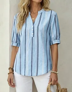 Detail of a light blue vertical striped women's blouse featuring a V-neck and button accents