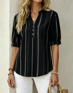 Detailed view of women's black short-sleeve V-neck blouse featuring vertical grey stripes