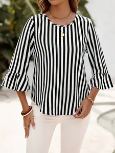 Close-up of a women's black and white vertical striped blouse featuring stylish bell sleeves