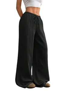 Vue détaillée du pantalon large en coton et lin noir avec cordon de serrage à la taille