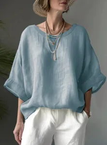 Comfortable loose fit women's blue linen-style shirt with drop shoulders and round neck.