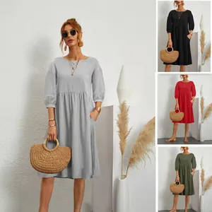 Cotton linen pleated dress with lantern sleeves and pockets shown in four different colors