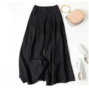 High waist cotton linen wide leg culottes in black styled with casual sneakers and bag