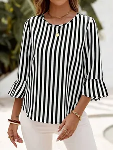 Detail view of women's black and white vertical striped top with stylish ruffle bell sleeves