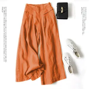 Detail view of orange cotton linen wide-leg pants with high elastic waist