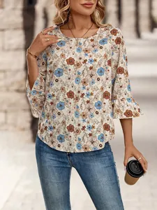 Close-up of woman wearing a floral print round neck blouse with bell sleeves