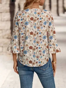 Back view of a stylish women's floral print blouse featuring elegant 3/4 bell sleeves.