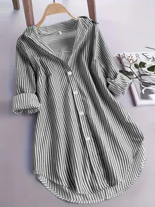 Loose-fit grey and white vertical striped long-sleeved shirt on a hanger.