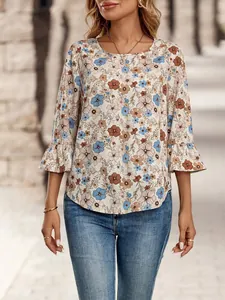 Detail view of a women's floral print top with crew neck and ruffled 3/4 sleeves on model