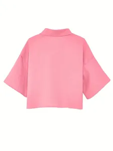 Back view of a pink cropped half-sleeve shirt with textured fabric and a classic collar design.