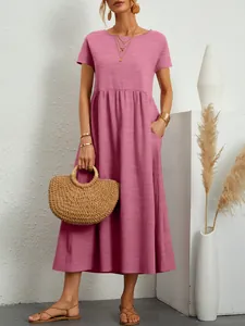 Casual pink short sleeve dress with round neck and elastic waist featuring side pockets