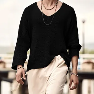 Close-up detail showing the breathable black hollow knit texture and relaxed V-neckline fit