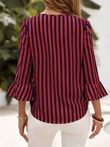 Back view of women's red and navy blue striped 3/4 sleeve top with stylish ruffle cuffs