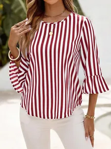 Detail of women's red and white vertical striped blouse with ruffled 3/4 sleeves