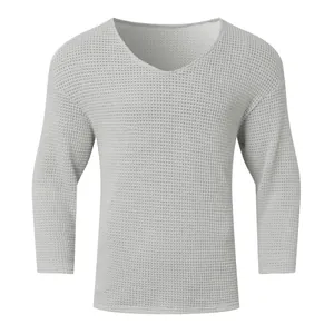 Detailed view of a retro solid color waffle knit V-neck long sleeve sweater for men