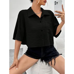 Chic black short sleeve button-up cropped shirt with pocket for a trendy casual look
