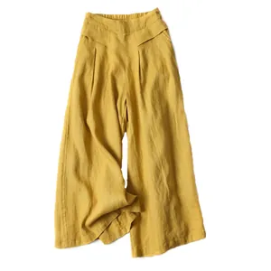 Detail of yellow cotton linen wide-leg culottes with elastic high waist and relaxed fit