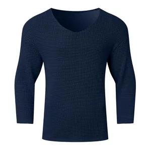 Detailed texture of navy blue men's V-neck long sleeve waffle knit sweater