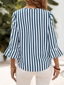 Back view of a women's blue and white striped 3/4 sleeve blouse with ruffle cuff detail.