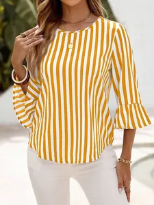 Detail view of the vertical stripe pattern and ruffle bell sleeve on a yellow top