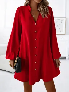 Detailed shot of a stylish red long-sleeved V-neck button-down A-line mini dress
