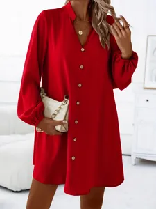 Detail view of a vibrant red V-neck button-down long sleeve A-line mini dress for women.
